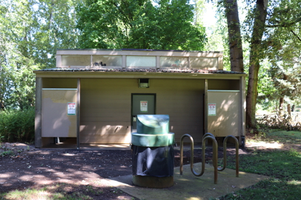 Restrooms on the Willamette River side of the park - hard surface - garbage can - bike rack - open May 31 - Sept 30